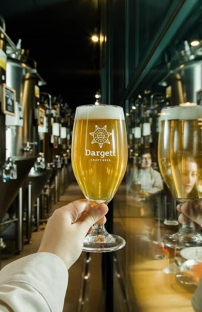 A glass of Dargett beer raised in the brewpub