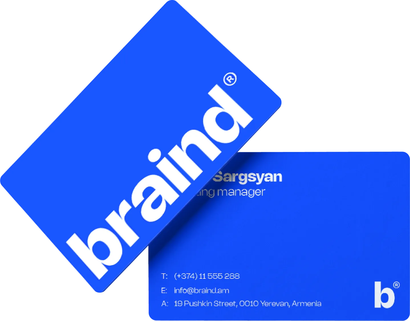 Two blue business cards: the front with the white braind® wordmark, the back with name, role, phone, email and address