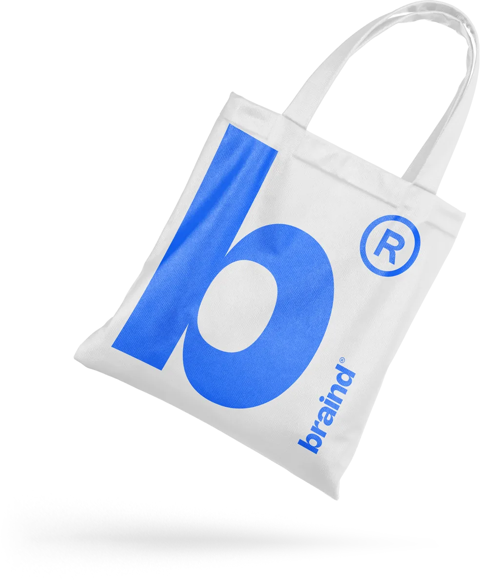 White tote bag with a large blue b® symbol and the braind wordmark